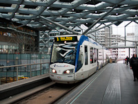 An Alstom Citadis tram of the RandstadRail seen at the viaduct of Den Haag Centraal