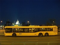 A Volánbusz serving as a suburban train replacement bus at Budapest, Batthyány-tér with the Hungarian Parliament in the background