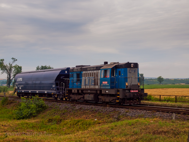 The LTE 740 413-0 seen at Jesensk zastvka hauling a single grain hopper as a freight train photo