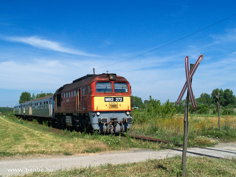 The M62 272 between Füzesabony and Mezőtárkány at a road-rail level crossing of a typical branch line style photo