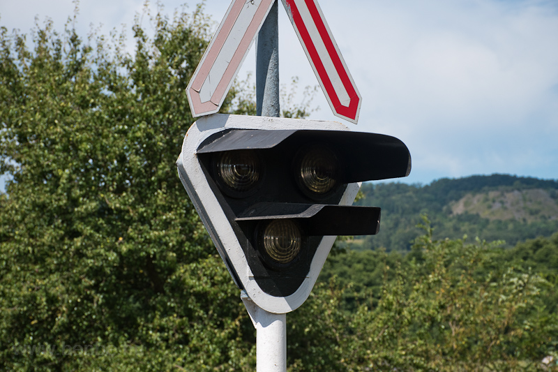 An old barrier light modernized, the original, rectangular green light's shape is still visible photo