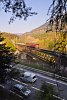 The RhB Ge 6/6<sup>II</sup> 705 is hauling a freight train from Disentis/Mustr to Landquart on the Hinterrhein-bridge by Reichenau-Tamins