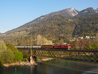 The RhB Ge 6/6<sup>II</sup> 705 is hauling a freight train from Disentis/Mustr to Landquart on the Hinterrhein-bridge by Reichenau-Tamins