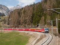 The Ge 4/4<sup>III</sup> 651 <q>Glacier on Tour</q> is hauling a St. Moritz to Chur REX on the second level over Bergn