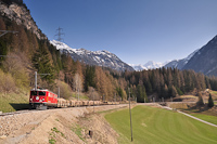 The RhB Ge 6/6<sup>II</sup> 702 is hauling a freight train between Bergn/Bravuogn and Preda