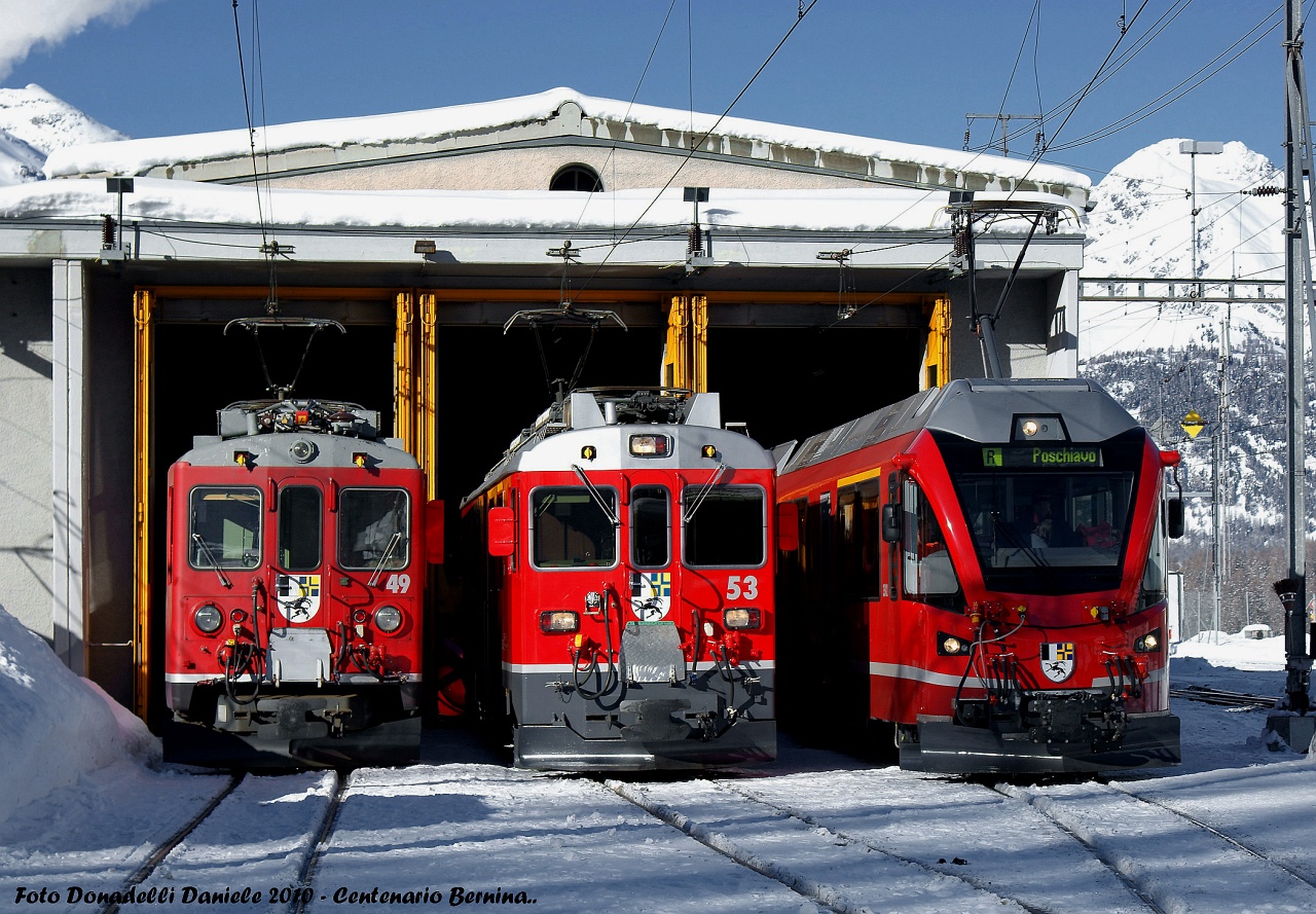 Three generations of Berninabahn railcars at Poschiavo depot photo
