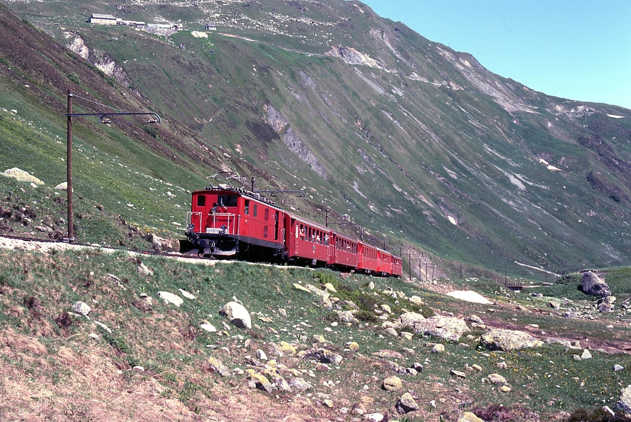 A Furka-Oberalp-Bahn HGe 4/4 locomotive on the Furka pass between Tiefenbach and Furka photo