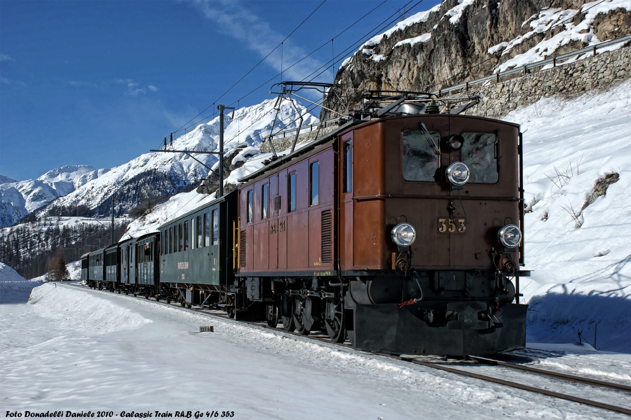 The RhB Ge 4/6 353 with a historic train by Ardez photo