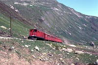 A Furka-Oberalp-Bahn HGe 4/4 locomotive on the Furka pass between Tiefenbach and Furka