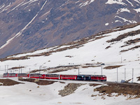 The ABe 4/4<sup>III</sup> 54 and 52 is seen hauling the Bernina-Express panoramic train near Ospizio Bernina