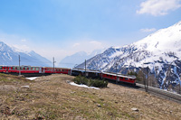 The ABe 4/4<sup>III</sup> 54 and 52 is seen hauling the Bernina-Express panoramic train at Alp Grm