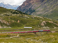 Two TW III railcars, the ABe 4/4<sup>III</sup> 54 and 55 are seen hauling the Bernina Express on the Obere Berninabachbrcke between Bernina Lagalb and Ospizi Bernina