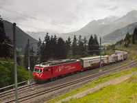 The MGB HGe 4/4<sup>II</sup> 104 is pulling a freight train out of the Las Rueras site of the Gotthard Base Tunnel construction to the main line of the Oberalppasstrecke