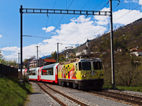 The yellow <q>log in</q> advertising livery is one of the less appealing ones. The RhB Ge 4/4<sup>II</sup> 611 is pulling the Glacier-Express Brig to Chur service at Tavanasa-Breil/Brigels.
