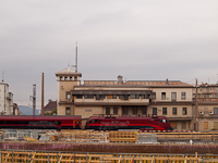 A railjet train is passing through the new Vienna central station pushed by the 1116 216-3