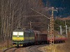 The ŽSCS 131 022-6 two-section direct current freight electric locomotive is leaving Csorba station with a freight train towards Poprd