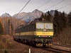 The ŽSCS 131 022-6 two-section direct current freight electric locomotive is leaving Csorba station with a freight train towards Poprd