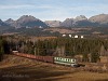 The ŽSCS 183 038-9 is hauling a freight train between Csorba (Štrba) and Csorba megll (Štrba zastvka) in the High Tatras