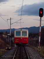 The rack-and-pinion multiple unit with driving trailer 905 952-8 is about to finish its descent by Štrba