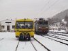The CFR 40-0198-9 ASEA-licensed locomotive and a yellow track maintenance railcar at Lunca Bradului