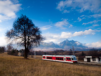 The ŽSSK TEŽ 425 958-6 seen at Nov Lesn with the Visok Tatry and Lomnicky Stt in the background