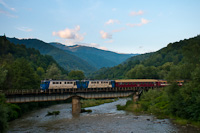 The CFR Calatori 60 1156-8 and 60 1356-9 seen hauling a fast train to Sighetu Marmatiei on the the bridge of the Viseu river between Petrova and Bistra Viseului