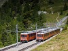 The Gornergratbahn (GGB) Bhe 4/8 3051 & 3053 seen passing by at the double-track section between Riffelalp and Riffelboden