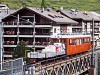 The Gornergratbahn Bhe 2/4 3021 seen pushing a freight train uphill between Zermatt and Findelbach on the bridge over the Mattervispa