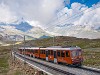 An unidentified Gornergratbahn (GGB) Bhe 4/6  seen between Rotenboden and Gornergrat with the Matterhorn in the photo's background