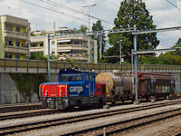 The SBB Cargo Eem 923 027-7 bimodal (electro-diesel) shunter locomotive seen at Spiez station with a local freight train
