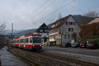 The Waldenburgerbahn Bt 111 seen between Niederdorf and Hirschlang, at the bank of the Frenke creek