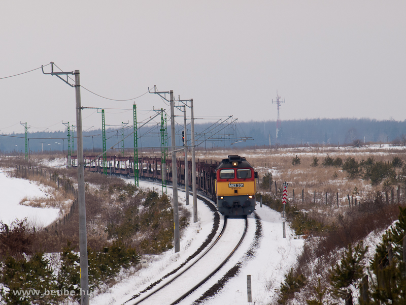 The M62 331 is pulling an empty car transporter train between Őriszentpter and Nagyrkos photo